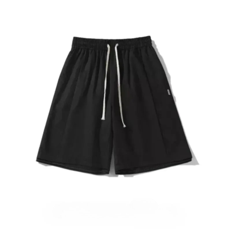 A pair of black shorts with white drawstrings.