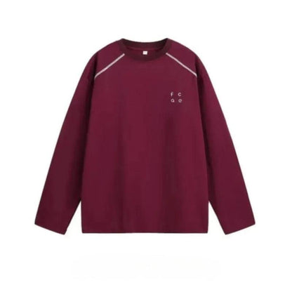 A burgundy long-sleeved shirt with a small white logo on the left chest area.