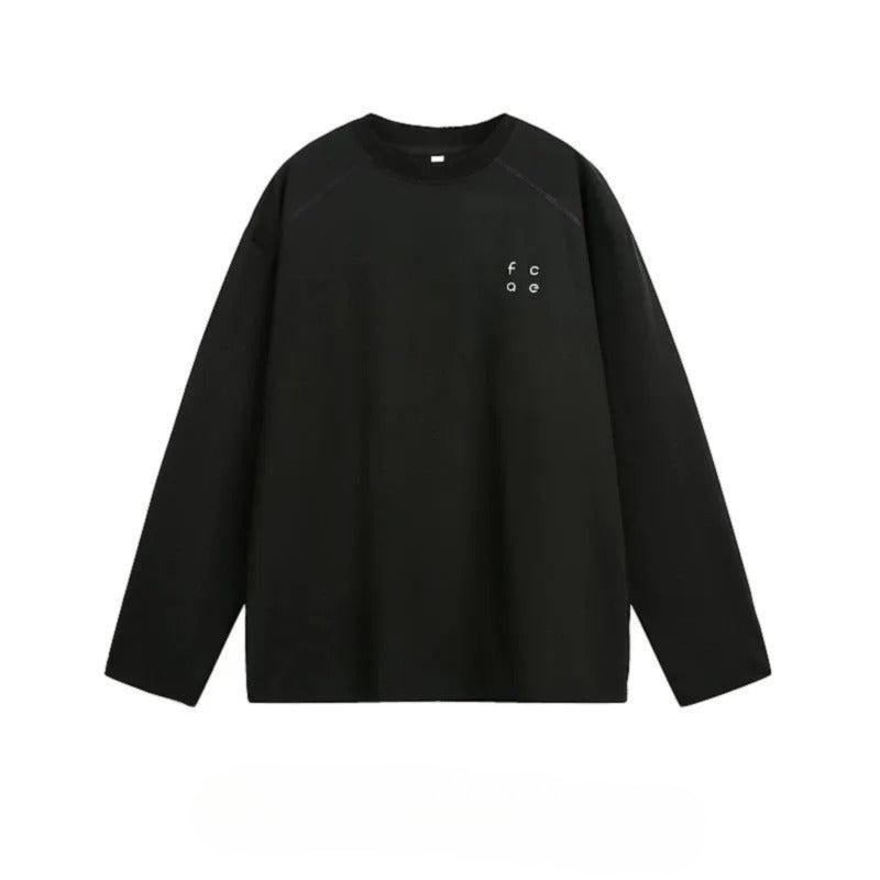 A black long-sleeved shirt with a small logo on the left side.