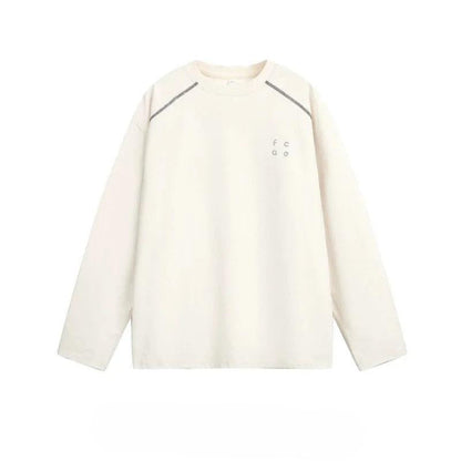 A cream-colored long-sleeved shirt with a small logo on the left side.