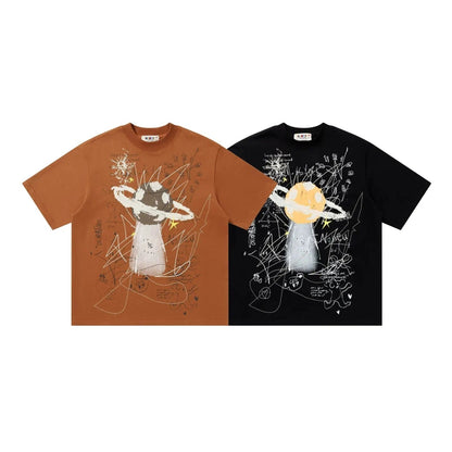 two t-shirts with artistic designs on them.