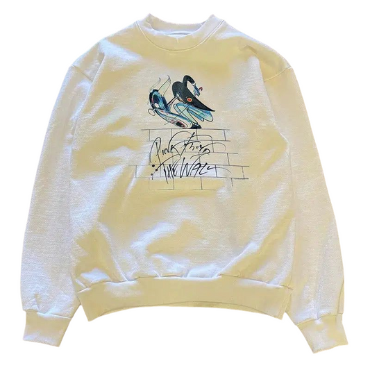 a white sweatshirt with a bird on it